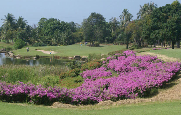 view over flowers to green at mountain shadow golf club, pattaya, thailand